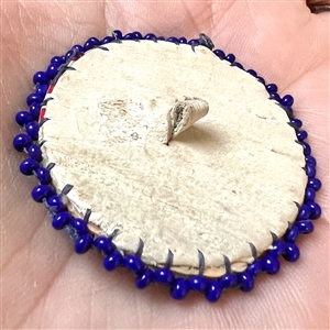 Native American beaded button of a thunderbird symbol.