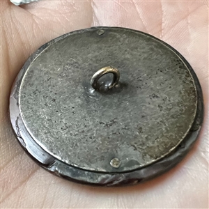 Victorian open work design of flowers over pearl button.