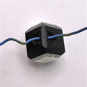 Black glass cube button with clear glass mirrored insets.