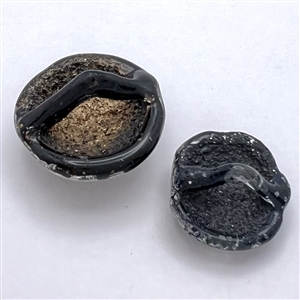 Two reverse painted French Couture glass buttons by André Molco.
