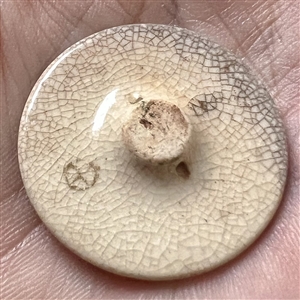 Japanese Satsuma button of a woman street vendor from Ohara.