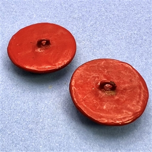 Two unusual multi-colored cinnabar buttons of flowers.