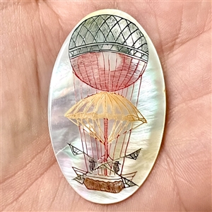 Incised pearl (?) button of a hot air balloon.