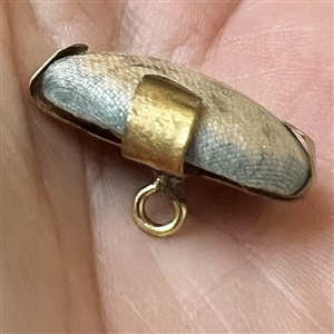 Vintage garter button of a young girl.