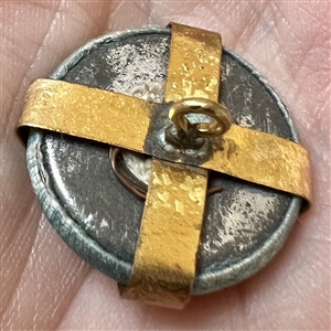 Vintage garter button of a young girl.