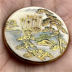 Japanese Satsuma button of sailboats on a lake.