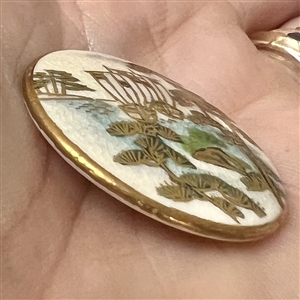Japanese Satsuma button of sailboats on a lake.
