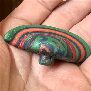 Sculpty clay studio button of a hat by Maria Kragh.