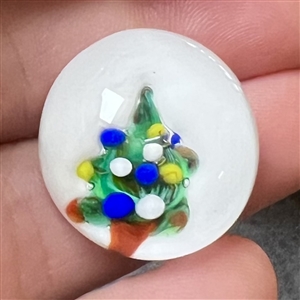 Glass paperweight studio button of a Christmas tree by John Gooderham.