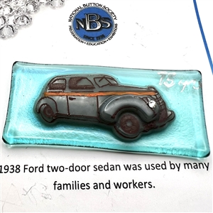 Kay Ferguson fused glass studio button of a 1938 Ford sedan.