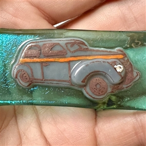 Kay Ferguson fused glass studio button of a 1938 Ford sedan.