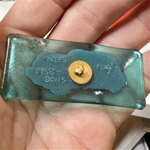 Kay Ferguson fused glass studio button of a 1938 Ford sedan.