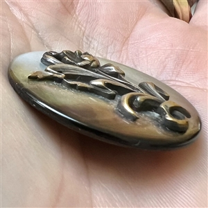 Art Nouveau pearl button with flower.