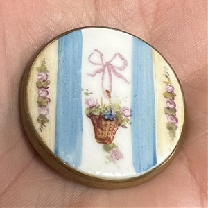 A 19th c. Painted porcelain button of bow  and basket of flowers.