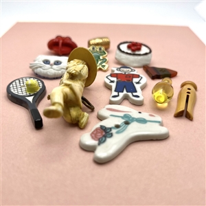 Twelve assorted  “little cuties” buttons.