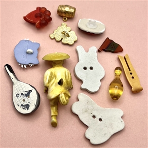 Twelve assorted  “little cuties” buttons.