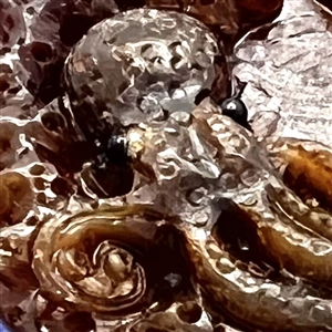 Resin or polymer button of an octopus. 
