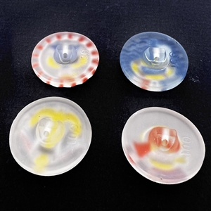 Set of four frosted clear glass buttons of nautical themes.