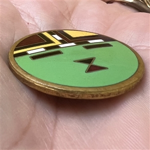 A 20th c. enamel button of native American design.