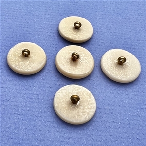 Set of five caramel glass buttons of musical instruments.