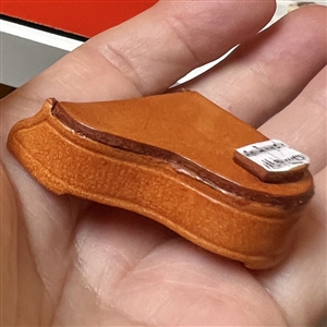 Leather button of a piano.