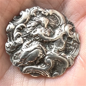 Hallmarked silver button of a woman playing a lyre. 