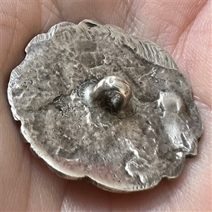 Hallmarked silver button of a woman playing a lyre. 