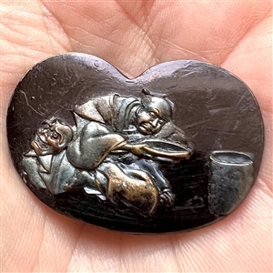 Japanese Shakudo button of robed figure.