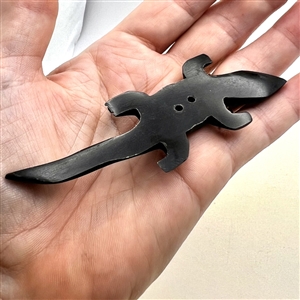 Carved horn (?) button of a salamander. 