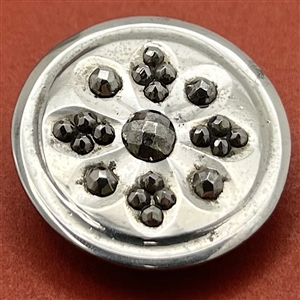 An 18th c. Steel button with concave design elements and cut steel.