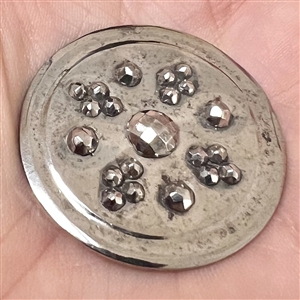 An 18th c. Steel button with concave design elements and cut steel.