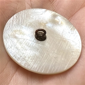 Bethlehem pearl button of “a cat chasing a rat.”