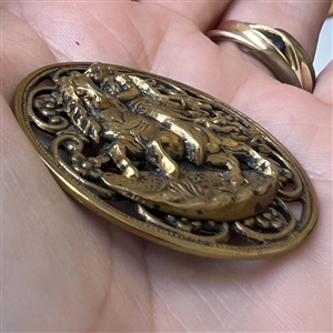 Brass button of “Henry of Navarre.”