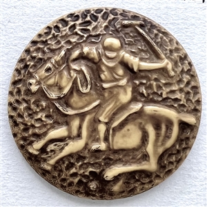 Vintage celluloid button of polo player on a horse.