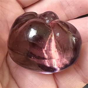 Sculptural transparent purple glass button of a pepper. 