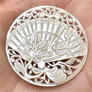 Elaborate Bethlehem pearl button of a fan and flora elements.