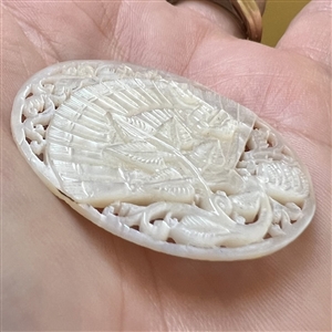 Elaborate Bethlehem pearl button of a fan and flora elements.
