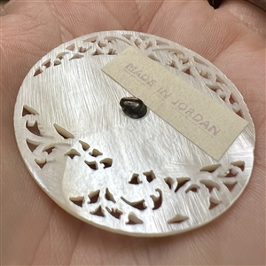 Elaborate Bethlehem pearl button of a fan and flora elements.