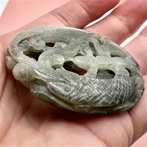 Thick jade trim of fish, water and plant life.