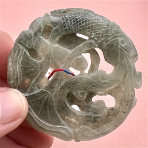 Thick jade trim of fish, water and plant life.