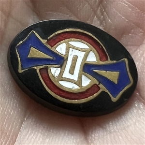 Composition button with enamel design.