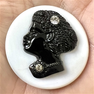 White glass and black glass button with a rosette shank of Sissieretta Jones.