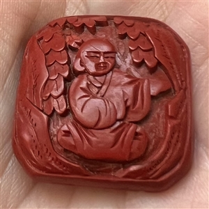 Chinese Cinnabar button of an Asian man.