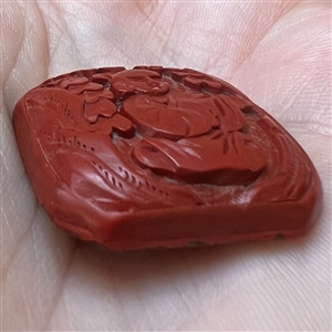 Chinese Cinnabar button of an Asian man.