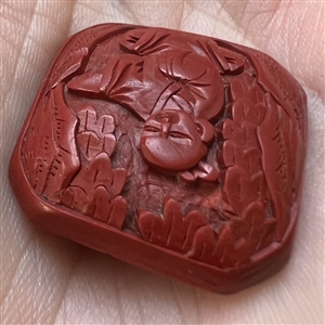 Chinese Cinnabar button of an Asian man.