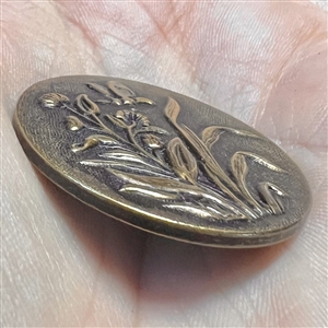 French tight button of plants with butterfly.