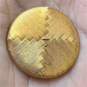 An 18th c. woven gold metal cap button of death's head design.