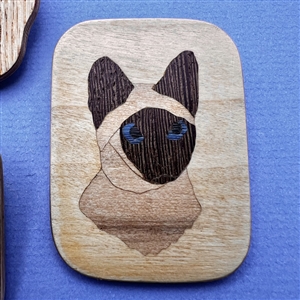 Three marquetry wood studio buttons of cats by Everett Hartman.