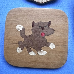 Three marquetry wood studio buttons of cats by Everett Hartman.