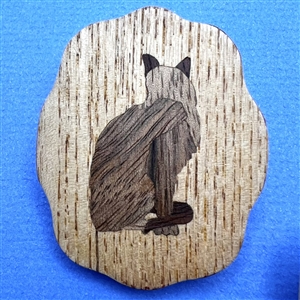 Three marquetry wood studio buttons of cats by Everett Hartman.
